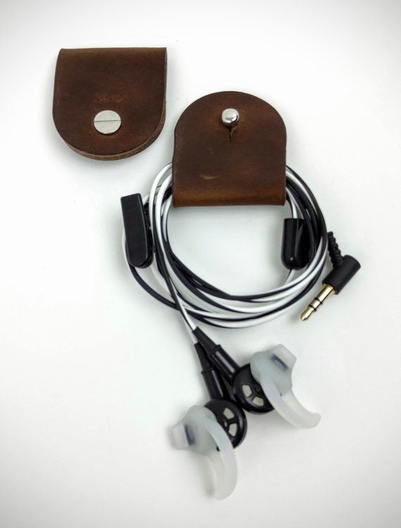 Headphones holder and cord keeper